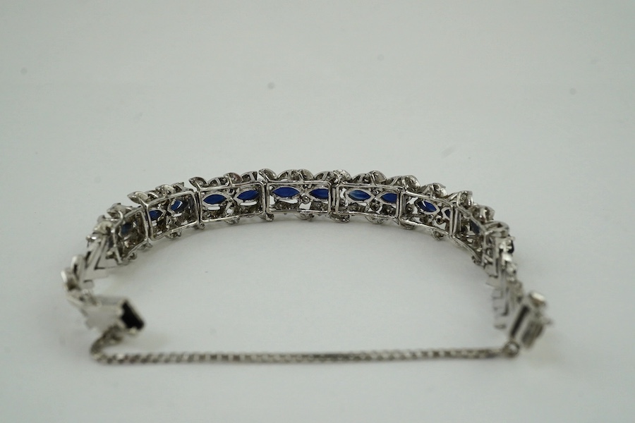 A modern white metal, synthetic? sapphire and diamond chip set bracelet, approx. 17cm. Condition - fair to good